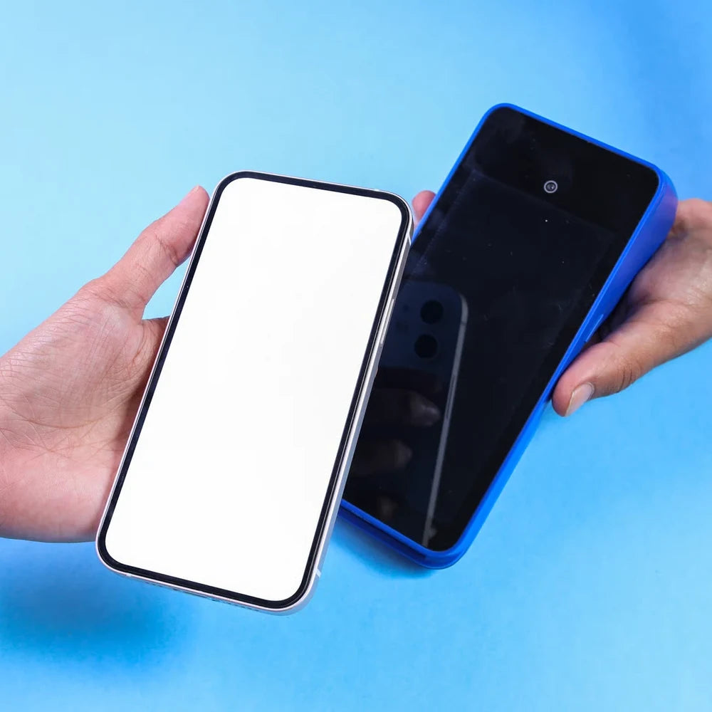 Two hands swapping smartphones