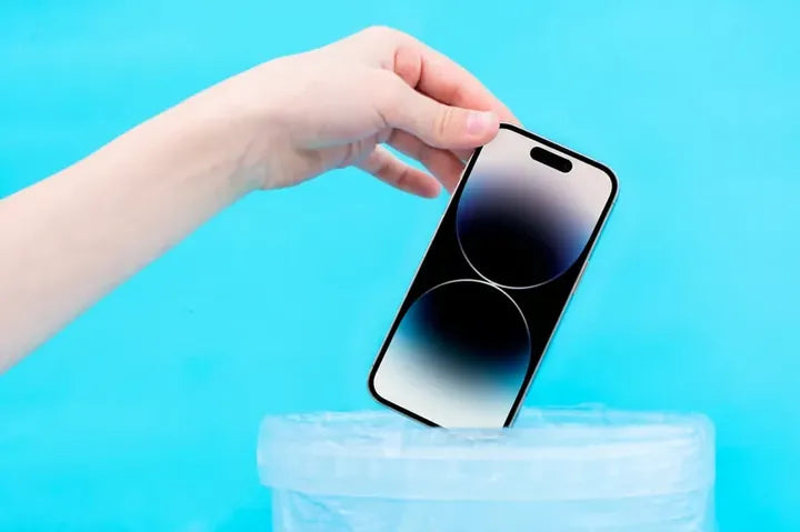 Phone going into a shipping bag